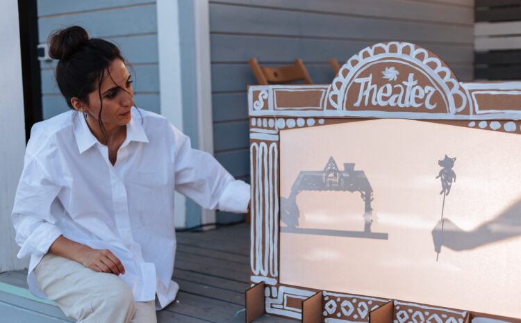 A photo showing workshop leader in shadow puppet making session