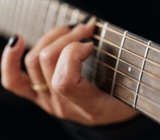 Guitarist playing guitar.
