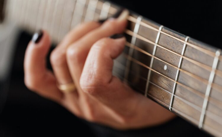Guitarist playing guitar.