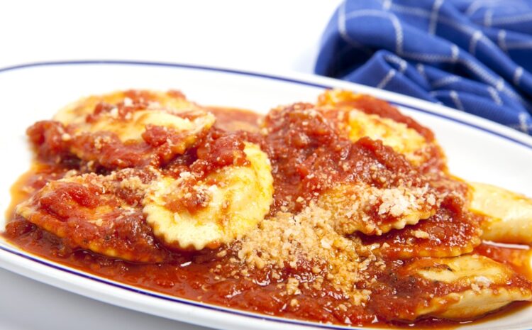 An image showing a dish of ravjul with tomato sauce
