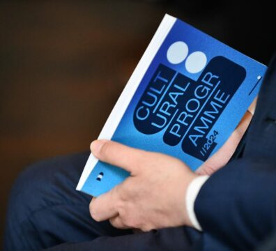 A photo showing a hand holding the Valletta Cultural Agency's programme for 2024