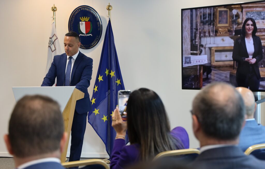 An image showing VCA Chairman Jason Micallef delivering an address at the exhibition on the Legacy of Valletta 2018 at Dar Malta in Brussels