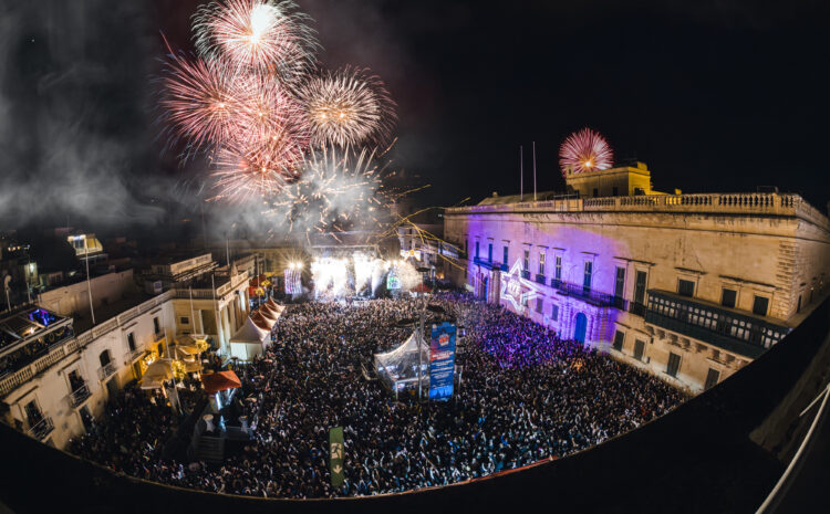A photo showing the crowd and fireworks during New Year's Eve celebrations in St George's Square, Valletta