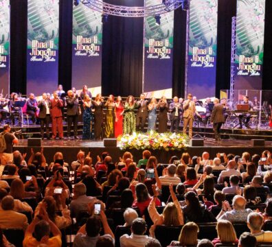 A photo showing singers on stage and the audience during the 2025 concert Ilħna li Jibqgħu