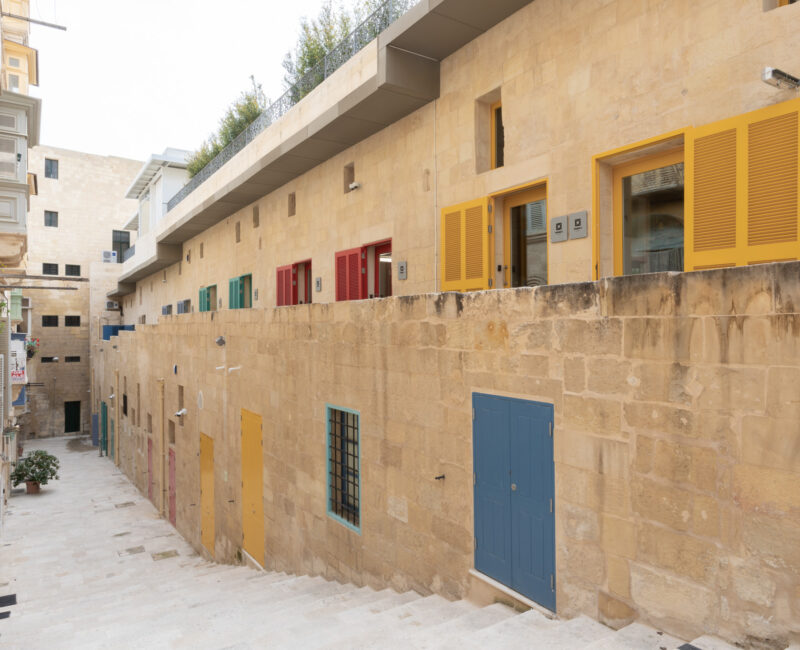 A photo showing the studios with colourful doors at the Valletta Design Cluster